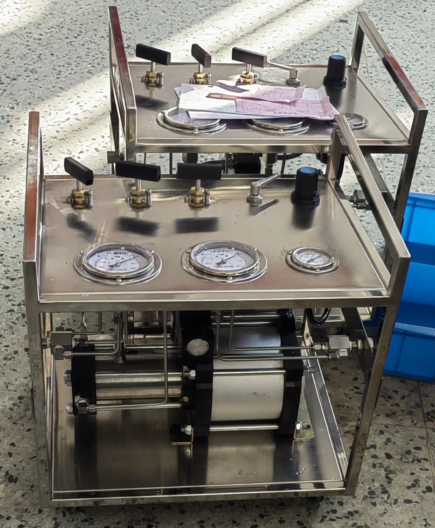 Multiple air driven liquid booster systems during workshop assembly and testing